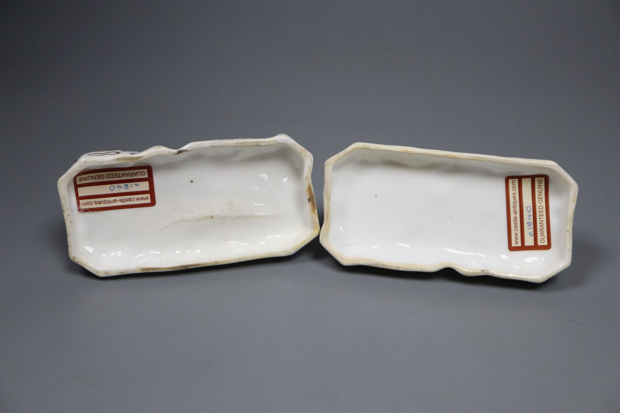 A pair of Grainger, Lee & Co. Worcester porcelain models of recumbent Great Danes, c.1820-37, 12.2cm long
